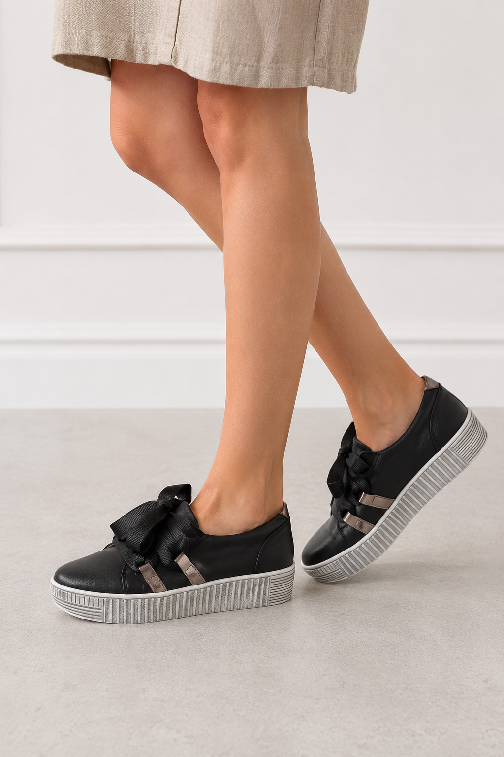 Model wearing Gelato Gypsy black platform sneaker