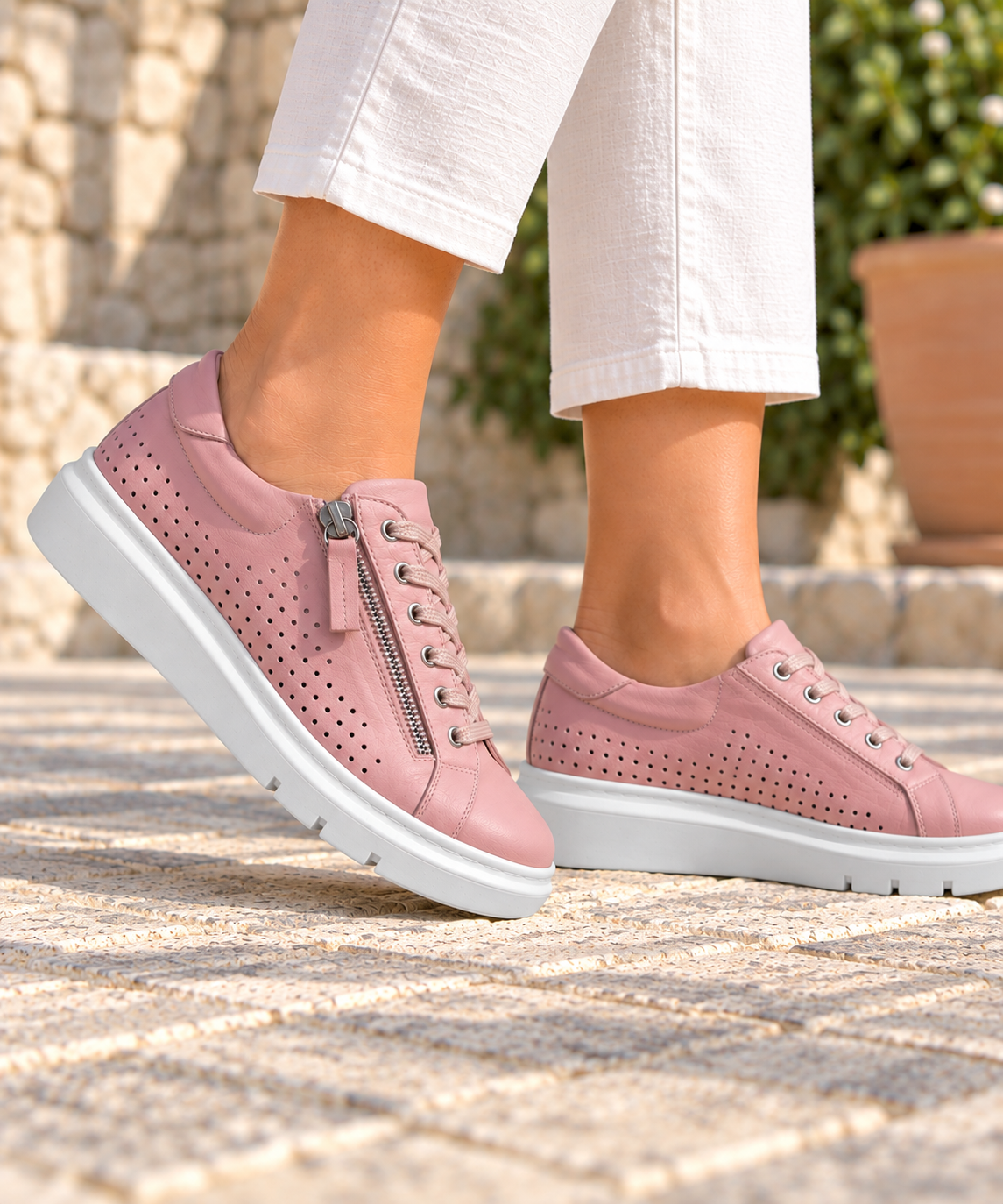 Rilassare - Treaty blush pink sneaker worn by a model from the knees down